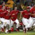 Stony Brook celebrates after defeating LSU 7-2 in Game 3 of an NCAA college baseball tournament super regional game in Baton Rouge, La., Sunday, June 10, 2012. Stony Brook advances to the College World Series. (AP Photo/Gerald Herbert)
