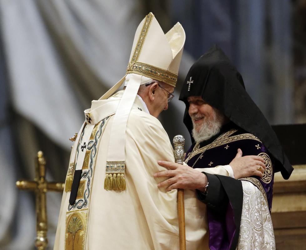 Pope Francis, left, is greeted by the head of Armenia's Orthodox Church Karekin II, during an Armenian-Rite Mass on the occasion of the commemoration of the 100th anniversary of the Armenian Genocide, in St. Peter's Basilica, at the Vatican, Sunday, April 12, 2015. Historians estimate that up to 1.5 million Armenians were killed by Ottoman Turks around the time of World War I, an event widely viewed by genocide scholars as the first genocide of the 20th century. Turkey however denies that the deaths constituted genocide, saying the toll has been inflated, and that those killed were victims of civil war and unrest. (AP Photo/Gregorio Borgia)