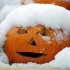 A jack-o'-lantern is covered with snow during a storm, Sunday Oct. 30, 2011, in Freeport, Maine. (AP Photo/Robert F. Bukaty)