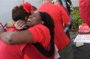 Robinson hugs another member of the Chicago Teachers Union as they celebrate the end of their strike in Chicago