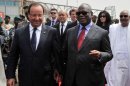French President Francois Hollande listens to Mali's Ibrahim Boubacar Keita on September 19, 2013 in Bamako