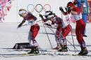 Norway's Therese Johaug, Norway's Marit Bjoergen and Poland's Justyna Kowalczyk, from left, start the women's 15k skiathlon at the 2014 Winter Olympics, Saturday, Feb. 8, 2014, in Krasnaya Polyana, Russia. (AP Photo/Dmitry Lovetsky)