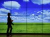 A staff member walks inside a priority banking service area of a Standard Chartered bank in Hong Kong