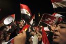 Protesters, opposing Egyptian President Mohamed Mursi, shout slogans during Mursi's speech to the nation in Cairo