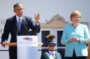 German Chancellor Merkel and U.S. President Obama make speeches after signing the guest book in Kruen