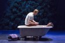 This theater image released by The Hartman Groups shows Bill Heck, left, and Liza Colon-Zayas during a performance of "Water By The Spoonful," a play by Quiara Alegria Hudes. (AP Photo/The Hartman Group, Richard Termine)