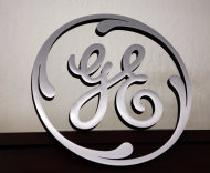 <p> FILE - In this Dec. 2, 2008 file photo, a General Electric (GE) sign is seen on display at Western Appliance store in Mountain View, Calif. General Electric is reporting a slight gain in net income in the second quarter and said Friday July 19, 2013 U.S. operations are picking up steam. (AP Photo/Paul Sakuma, file)