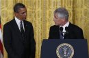 Former U.S. Senator Hagel turns to U.S. President Obama after being nominated to be Defense Secretary at the White House in Washington