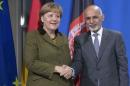 Afghanistan's President Ghani and German Chancellor Merkel shake hands during a news conference after their meeting at the Chancellery in Berlin