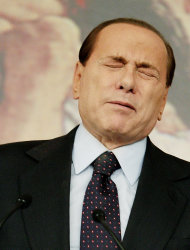 FILE - In this Feb. 9, 2011 file photo, Italian former premier Silvio Berlusconi grimaces during a press conference in Rome, Italy. A court in Italy has convicted, Friday, Oct. 26, 2012, former
   Premier
 Silvio Berlusconi of tax fraud and sentenced him to four years in prison. In Italy, cases
 must pass two levels of appeal before the verdicts are final. Berlusconi is expected to appeal. (AP Photo/Pier Paolo Cito, File)
