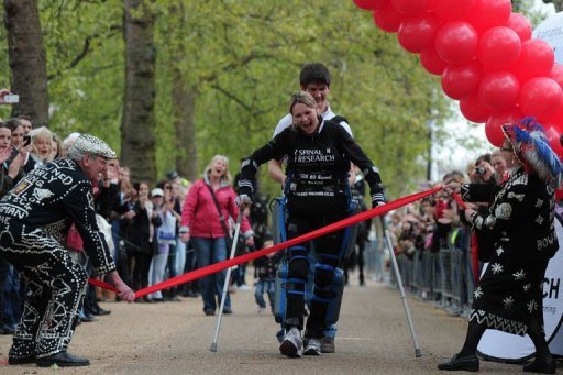 Claire Lomas, who is paralysed and walks with the aid of a "bionic" suit, finishes the London Marathon
