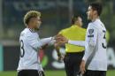 Germany's Serge Gnabry, left, celebrates with his teammate Jonas Hector after scoring a goal against San Marino during their 2018 World Cup Group C qualifying soccer match between San Marino and Germany at the Serravalle stadium in San Marino, Friday, Nov. 11, 2016. (AP Photo/Marco Vasini)