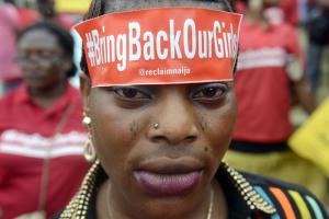 A woman with a sticker on her head bearing the slogan&nbsp;&hellip;