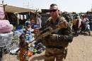 A French soldier patrols a market in Gao, northern Mali