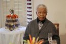 Former South African president Nelson Mandela looks on as he celebrates his birthday at his house in Qunu