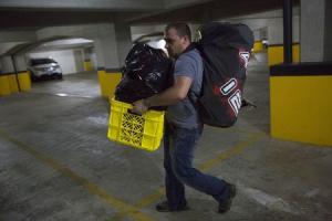 Felice Ferris, a mechanical engineer, carries his belongings …