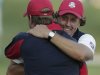 USA's captain Davis Love III hugs Phil Mickelson on the 17th hole after winning a four-ball match at the Ryder Cup PGA golf tournament Friday, Sept. 28, 2012, at the Medinah Country Club in Medinah, Ill. (AP Photo/Charlie Riedel)