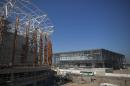 The Arena do Futuro, that will host handball games, right, and Arena Carioca 1, left, are seen under construction at the Olympic Park of the 2016 Olympics in Rio de Janeiro, Brazil, Thursday, June 11, 2015. Rio will host the Olympic Games in 2016. (AP Photo/Felipe Dana)