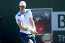 Andy Murray of Great Britain hits a return to Lukas Rosol of the Czech Republic during the BNP Paribas Open at Indian Wells Tennis Garden on March 8, 2014 in Indian Wells, California