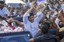 Leader of YSR Congress party Reddy gestures to his supporters after he was released on bail from Chanchalguda central prison in Hyderabad