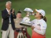 Inbee Park of South Korea kisses the trophy after winning the LPGA Golf Championship in Pittsford