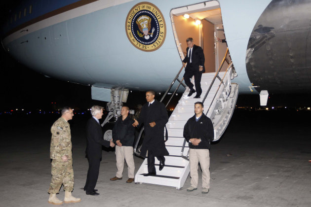 President Barack Obama is greeted by Lt. Gen. Curtis "Mike" Scaparrotti, left, and U.S. Ambassador to Afghanistan Ryan Crocker, second left, as he steps off Air Force One at Bagram Air Field in Afghanistan, Tuesday, May 1, 2012. (AP Photo/Charles Dharapak)