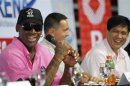 Former NBA Chicago Bulls player Dennis Rodman shares a light moment during a news conference inside a mall of Asia Arena in Manila