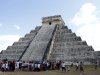 People gather in front of the Kukulkan Pyramid in Chichen Itza, Mexico, Thursday, Dec. 20, 2012. American seer Star Johnsen-Moser led a whooping, dancing, drum-beating ceremony Thursday in the heart of  Mayan territory to consult several of the life-sized crystal skulls, which adherents claim were passed down by the ancient Maya. (AP Photo/Israel Leal)