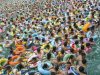 File photo showing residents crowding in a swimming pool to escape the summer heat during a hot weather spell in Daying county of Suining