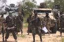 The leader of the Nigerian Islamist extremist group Boko Haram, Abubakar Shekau (C) on July 13, 2014