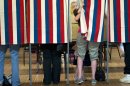 Voting Begins in Iowa Battleground