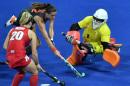 Netherlands' Lidewij Welten (L top) vies with Britain's goalkeeper Maddie Hinch during the women's Gold medal hockey Netherlands vs Britain match of the Rio 2016 Olympics Games at the Olympic Hockey Centre on August 19, 2016