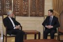 Syria's President Bashar al-Assad meets Iran's Supreme National Security Council Secretary Saeed Jalili in Damascus