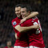 Manchester United's Robin van Persie, right, celebrates with teammate Ryan Giggs after scoring his third goal against Aston Villa during their English Premier League soccer match at Old Trafford Stadium, Manchester, England, Monday April 22, 2013. (AP Photo/Jon Super)