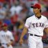 Texas Rangers' Darvish looks on after giving a hit to Detroit Tigers' Martinez to score a run during their MLB game in Arlington