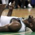 Boston Celtics forward Kevin Garnett (5) yells after hitting the floor hard while vying for a rebound against the Miami Heat during the second quarter of Game 3 in the NBA basketball playoffs Eastern Conference finals, in Boston on Friday, June 1, 2012. (AP Photo/Elise Amendola)