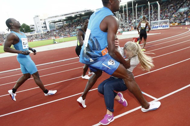 Usain Bolt of Jamaica collides …