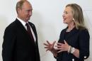 Russian President Vladimir Putin (L) listens to former US Secretary of State Hillary Clinton during the Asia-Pacific Economic Cooperation Summit in Vladivostok, Russia on September 8, 2012