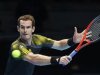 Britain's Murray hits a return to France's Tsonga during their men's singles tennis match at the ATP World Tour Finals in London