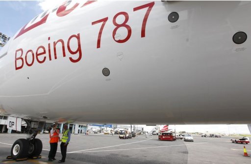 Aviation engineers inspect an Ethiopian Airlines' 787 Dreamliner after it arrived at the Jomo Kenyatta international airport in Kenya’s capital Nairobi