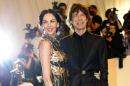This photo taken on May 2, 2011 shows designer L'Wren Scott and musician Mick Jagger at The Metropolitan Museum of Art in New York