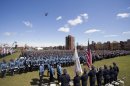 Handout of helicopters fly over as MIT Police are joined by U.S. Vice President Biden during a memorial service for MIT Patrol Officer Sean Collier at MIT in Cambridge