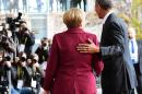 German Chancellor Angela Merkel greets US President Barack Obama in Berlin on November 18, 2016