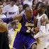 Los Angeles Lakers guard Kobe Bryant (24) drives against Miami Heat guard Dwyane Wade during the first half of an NBA basketball game, Sunday, Feb. 10, 2013, in Miami. (AP Photo/Wilfredo Lee)