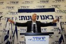 In this Wednesday, Jan. 23, 2013 photo, Yair Lapid gestures as he delivers a speech at his "Yesh Atid" party in Tel-Aviv. The party, formed just over a year ago, out did forecasts by far and are predicted to capture as many as 19 seats, becoming parliament's second-largest party, after Netanyahu's Likud-Beiteinu bloc, which won 31, according to the exit polls. (AP Photo/Sebastian Scheiner)