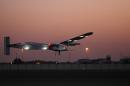 Solar-powered plane Solar Impulse 2, takes off from the Emirati capital Abu Dhabi's small Al-Bateen airport during a third test flight early on March 2, 2015