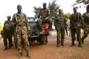 South Sudanese soldiers gather near a truck as they patrol the streets of Juba on January 2, 2014