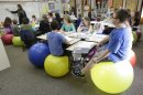 Teachers ditch student desk chairs for yoga balls