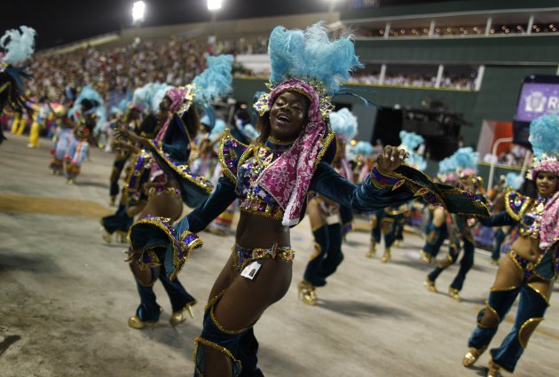Revellers from Paraiso do Tuiuti samba school dance during the second night of the A Group annual Carnival parade in Rio de Janeiro's Sambadrome