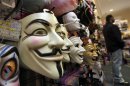 FILE - In this Oct. 21, 2011 file photo, masks, including "V for Vendetta," left, are displayed at a Ricky's Halloween store in New York. Television audiences across China watched an anarchist antihero rebel against a totalitarian government and persuade the people to rule themselves. Soon the Internet was crackling with quotes of 